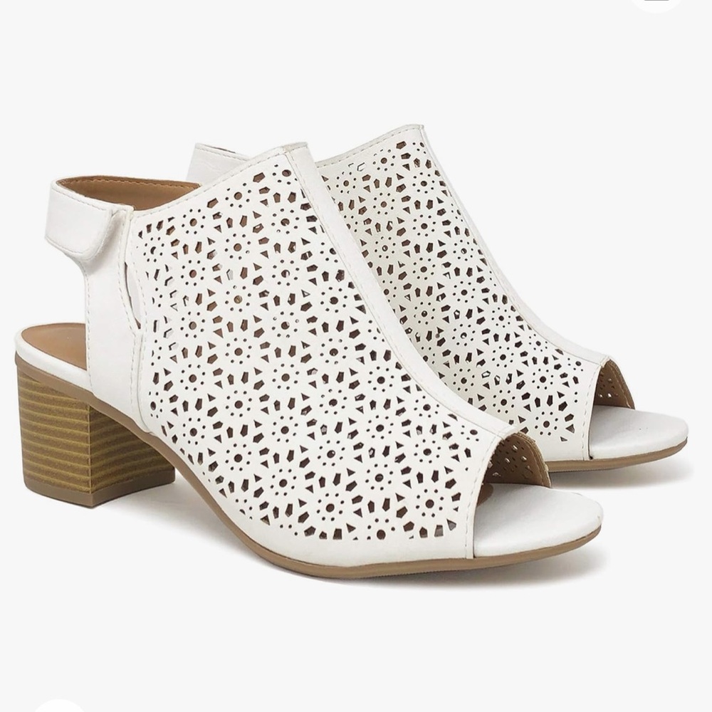 Women's Elect Caged Geometric Laser Cut Out Peep toe in good used condition.